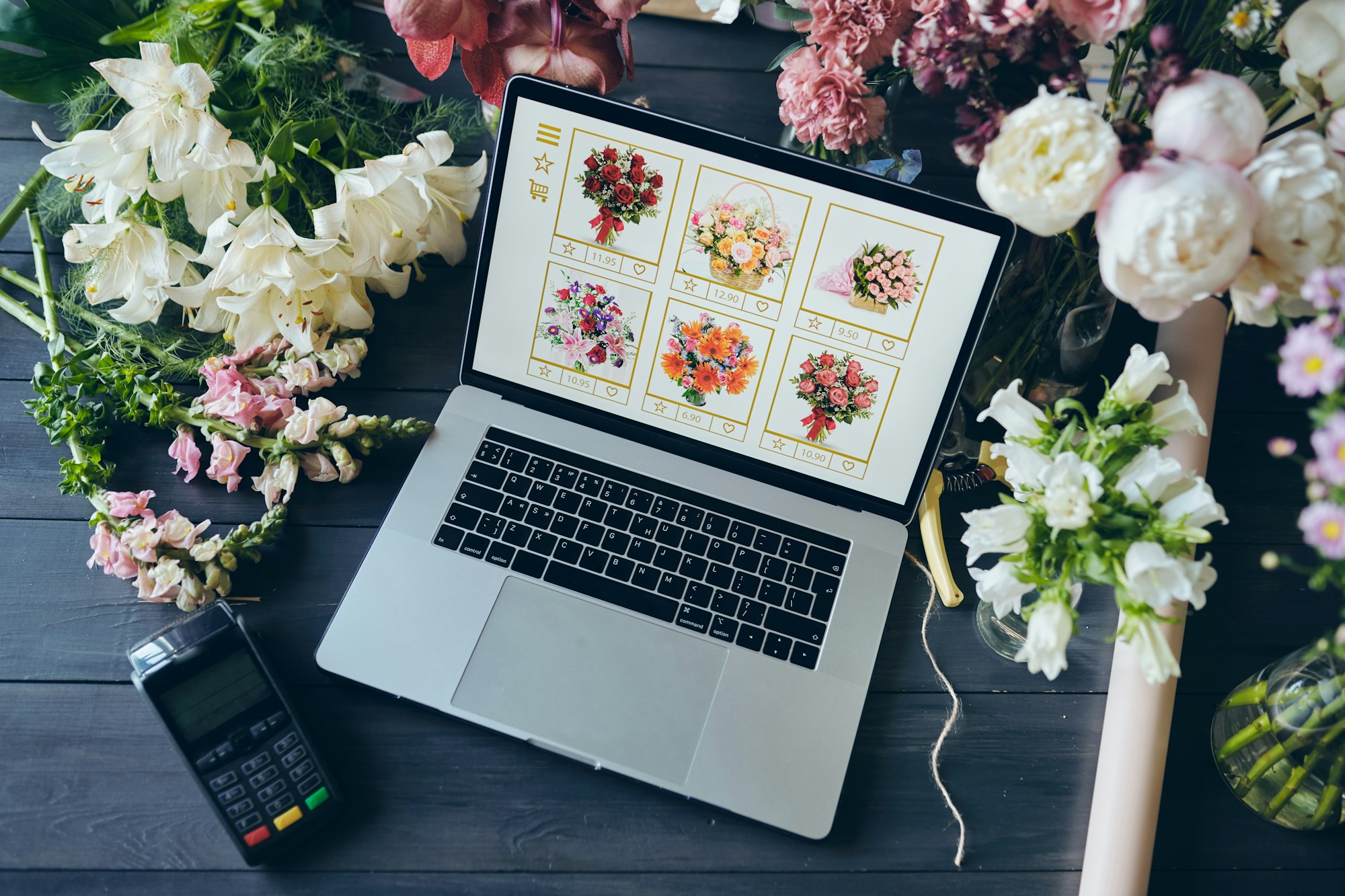 Above view of open laptop with flower shop website